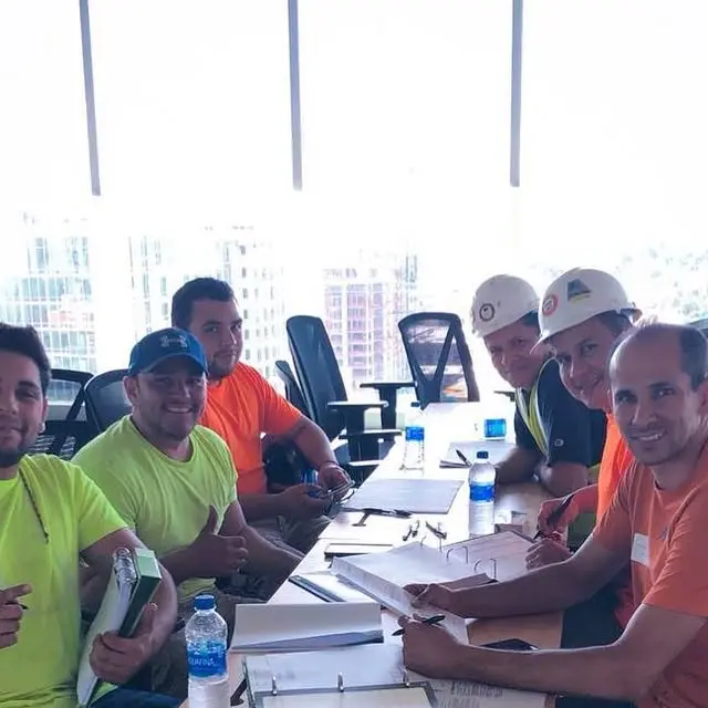 Schettini Floor Solutions team gathered around a table